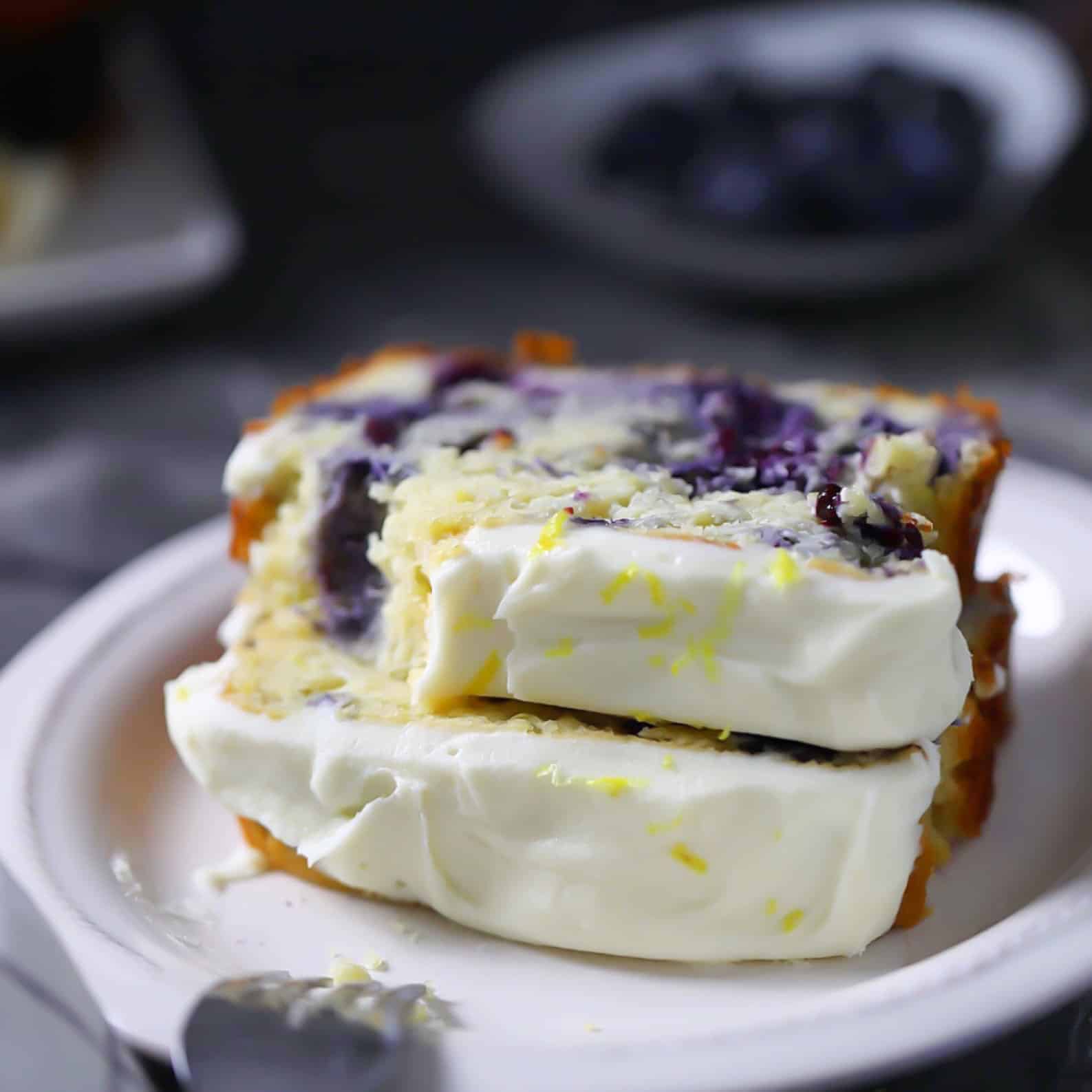 Low-Carb, Keto Lemon Blueberry Bread Loaf Slices with lemon icing